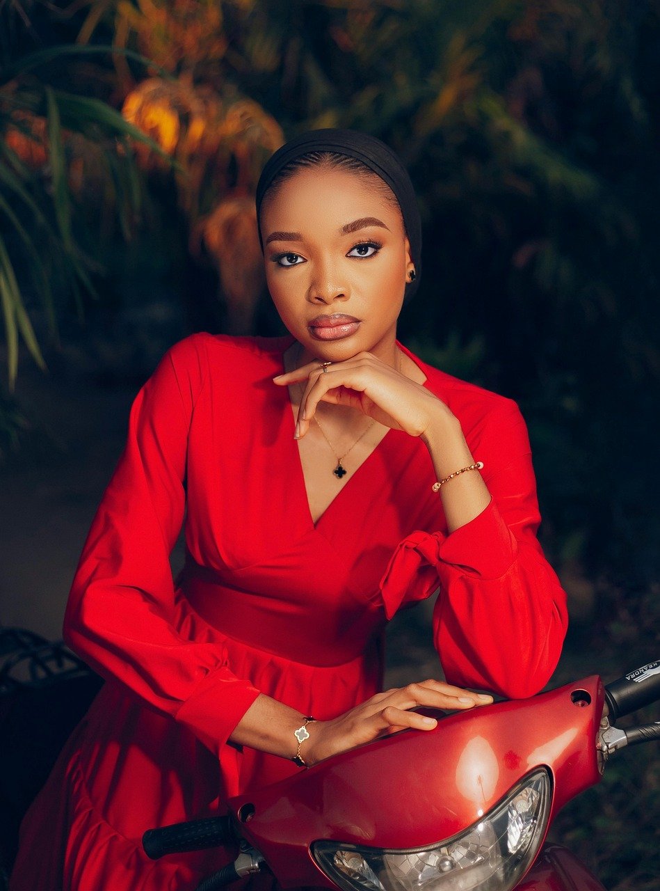 Lady wearing red dress with beautiful necklace and bracelet